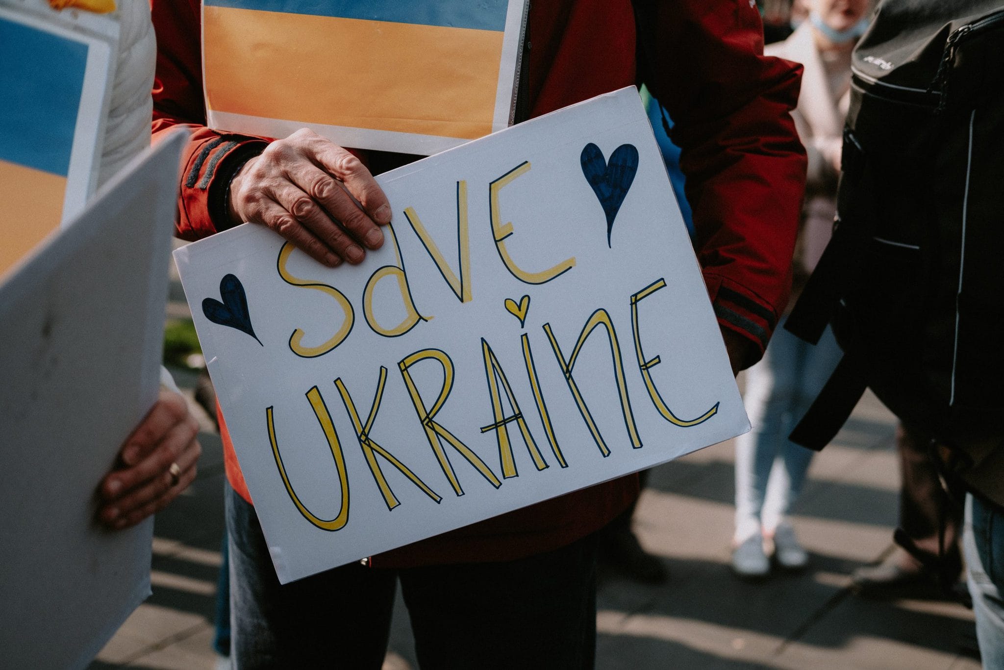 Save Ukraine Sign at a protest VENTUREWRITE Blog